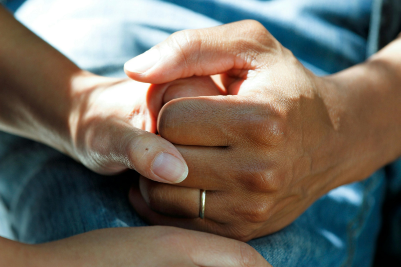 A person holding another person's hand